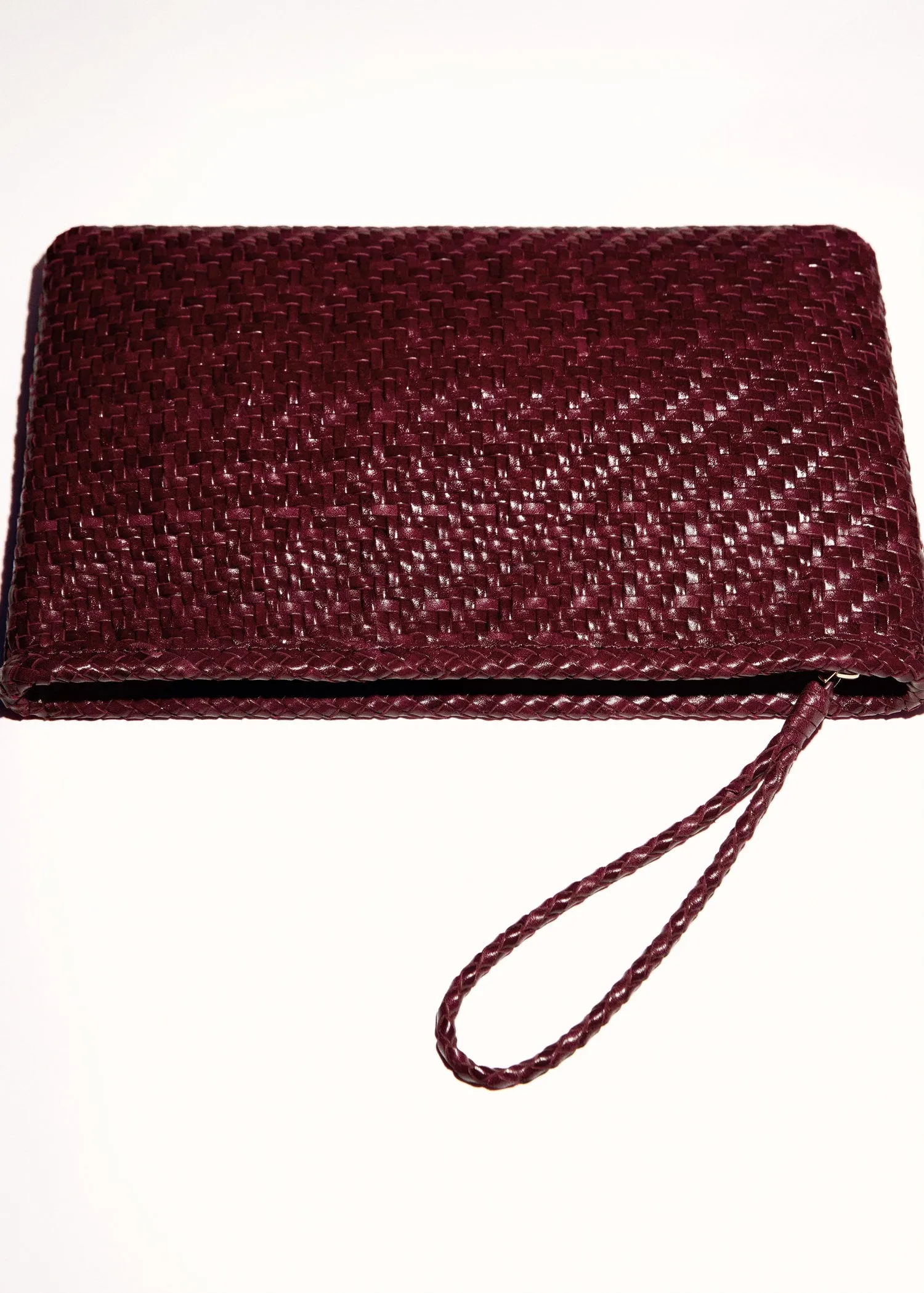 Braided leather clutch
