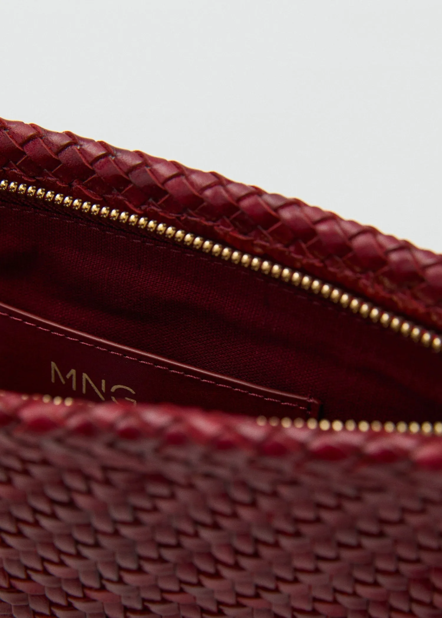 Braided leather clutch