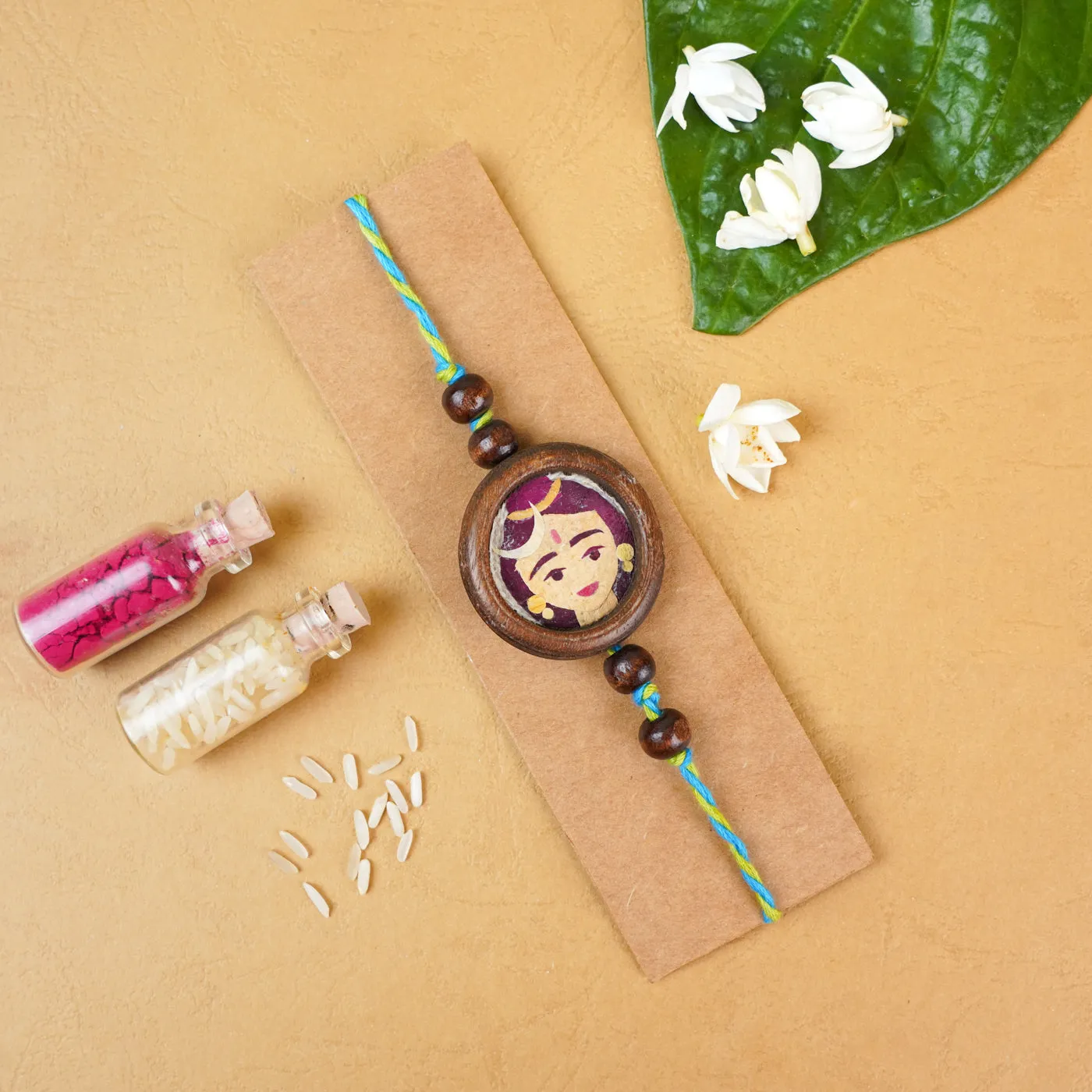 Handmade Eco-friendly Shiv Pressed Flower Rakhi with Roli Chawal