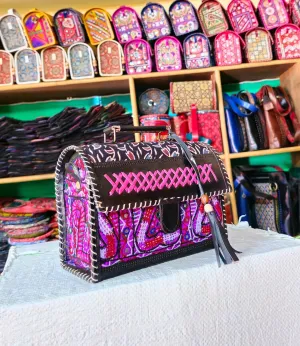 Leather Hut Bag With Hand Block Print Mashroo Material With Antique Embroidery on it. Size 7 * 9 inch.