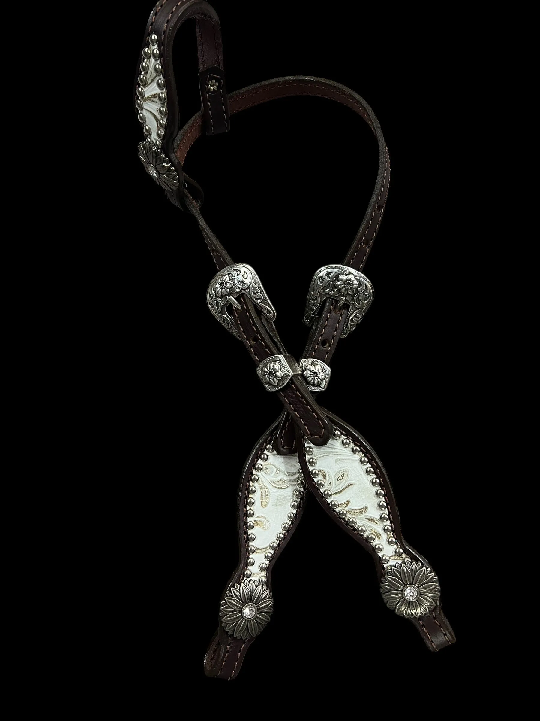 White and silver floral on dark leather