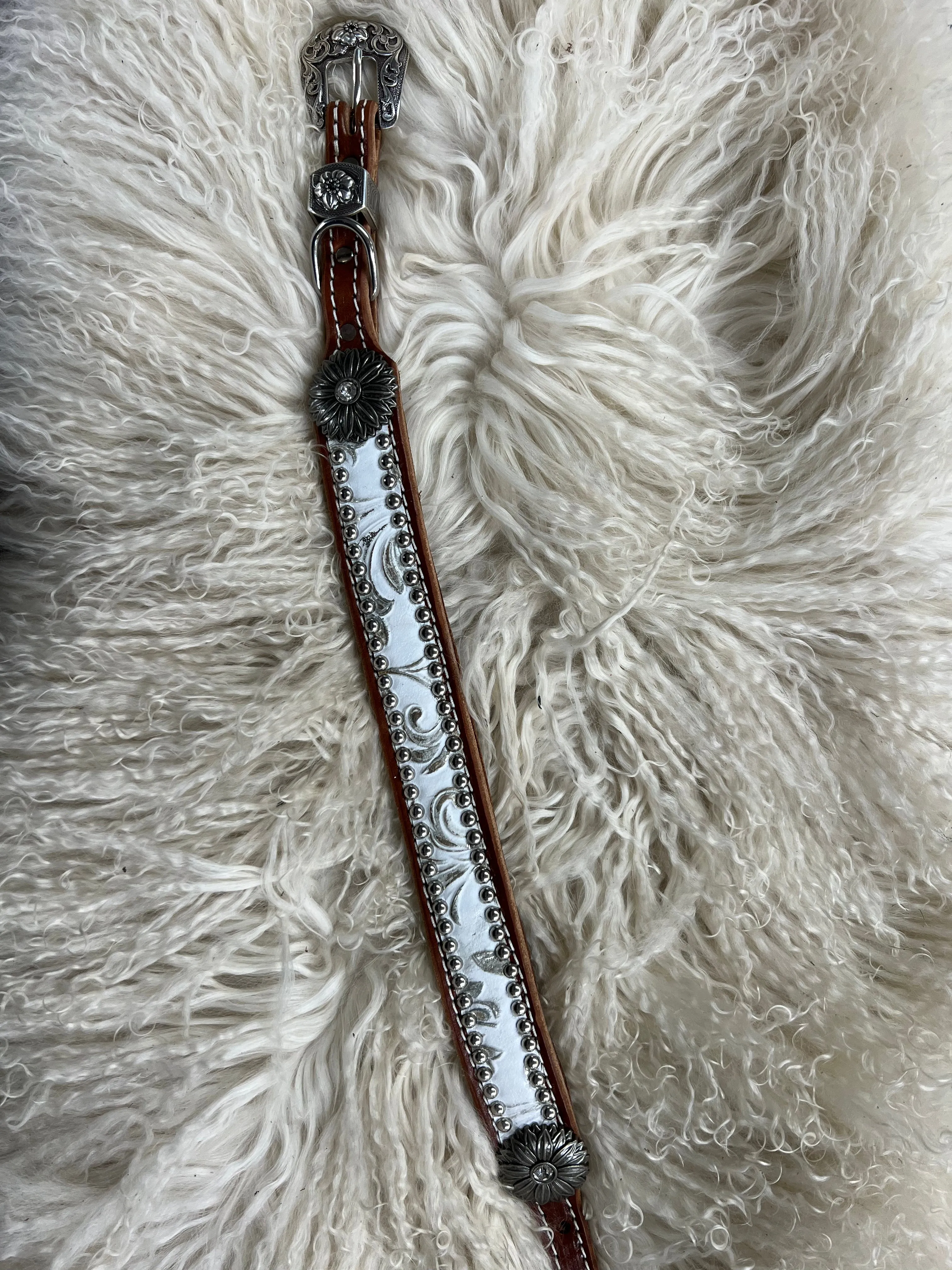 White and silver floral on dark leather