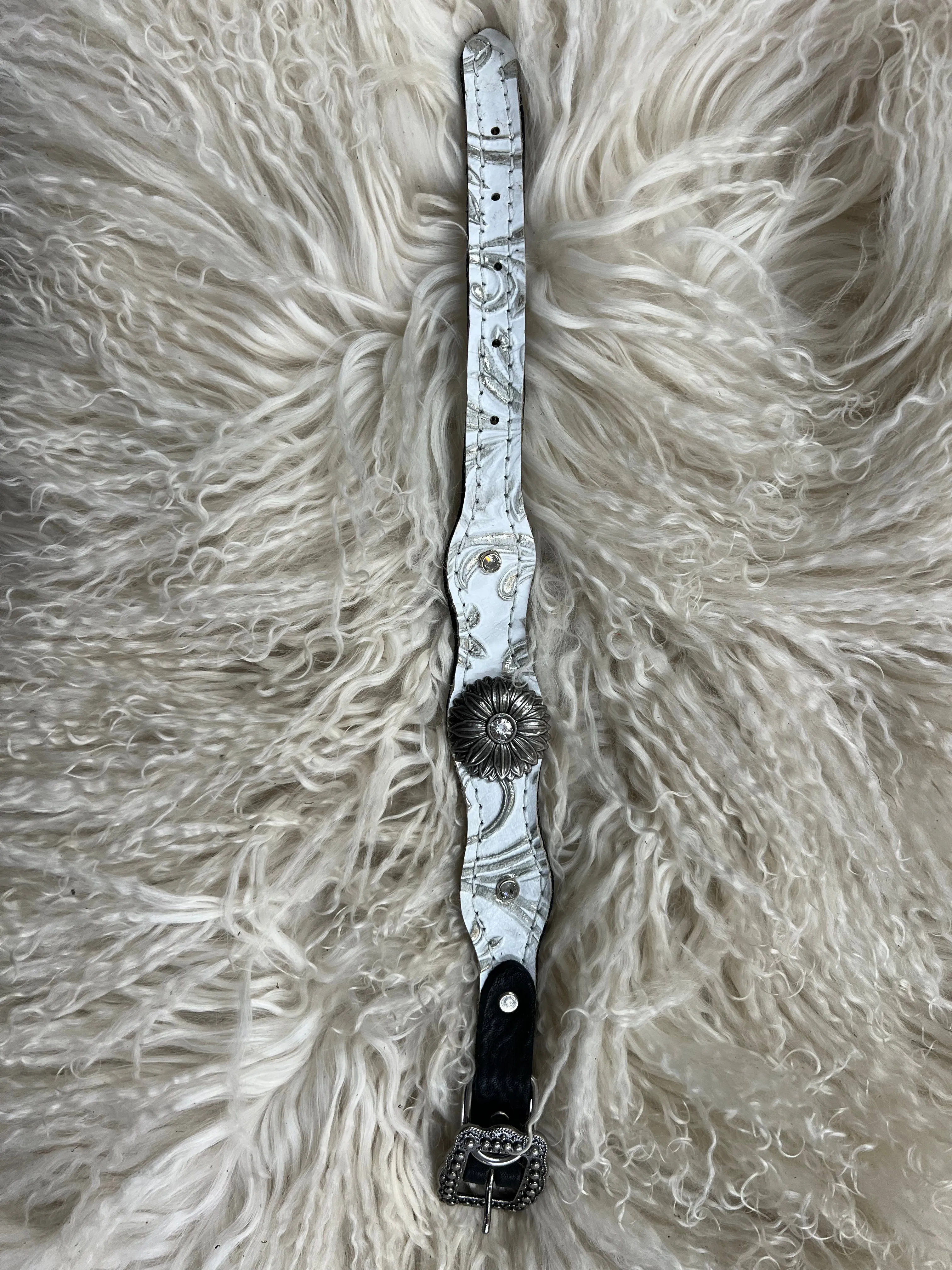 White and silver floral on dark leather